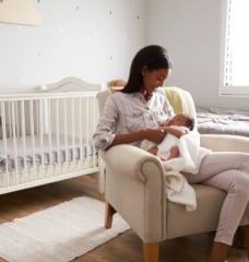 mom holding her infant in