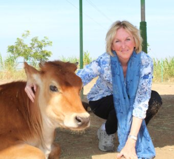 PETA founder Ingrid Newkirk with a cow