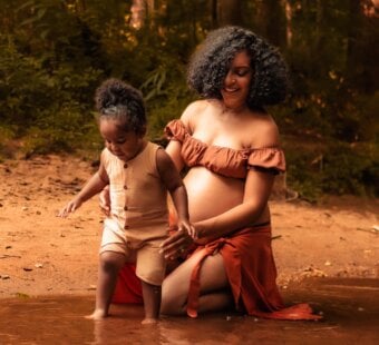 Ashley Renne and her son in the water playing